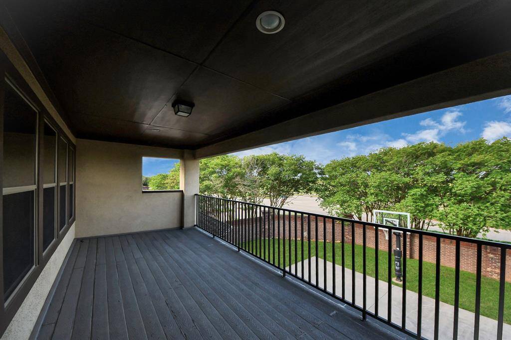 Nice balcony located outside the game room overlooking the backyard