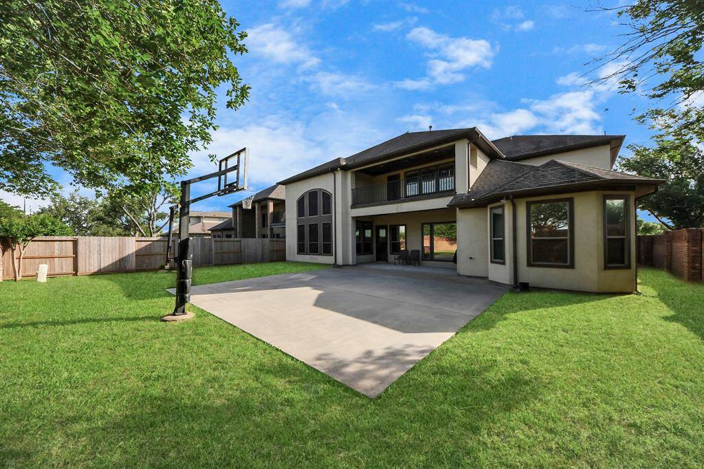 Outside, you have a nice sized backyard with professional style basketball goal