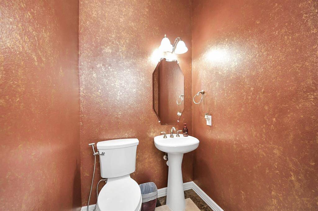 To the left, a half bath for guests to use