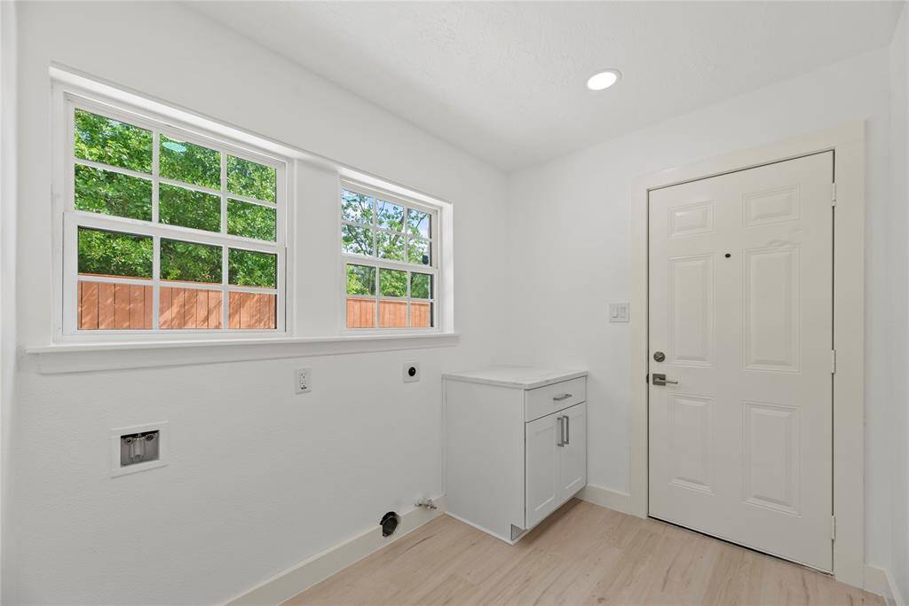 Large bright utility/mudroom.