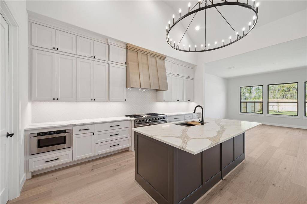 Kitchen and view of Game Room/Flex Space