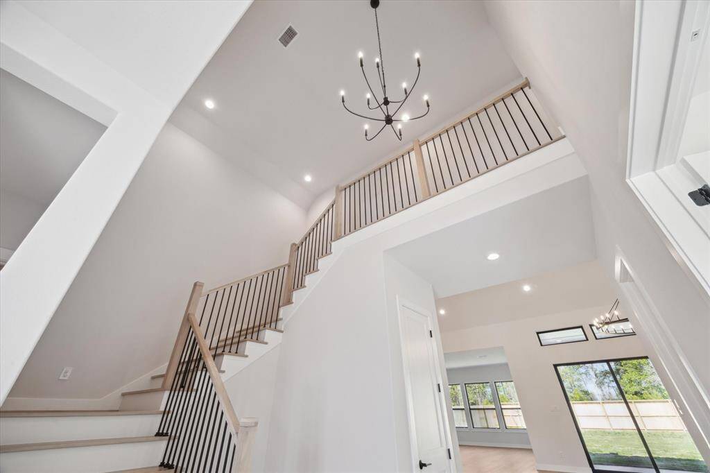 2-story Foyer luminated by stunning fixture
