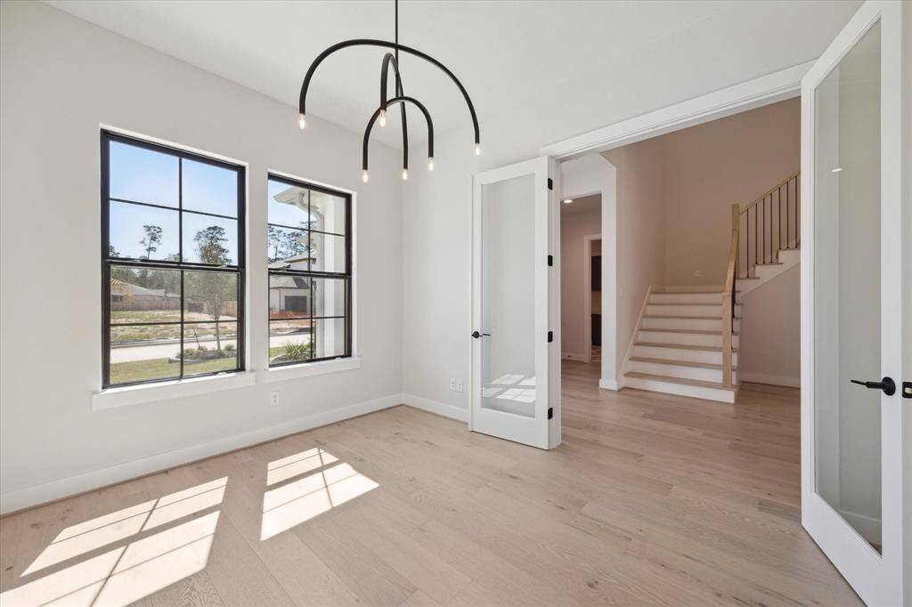 Home Office/Study, found off the Foyer, has glass double doors and ensuite Bath