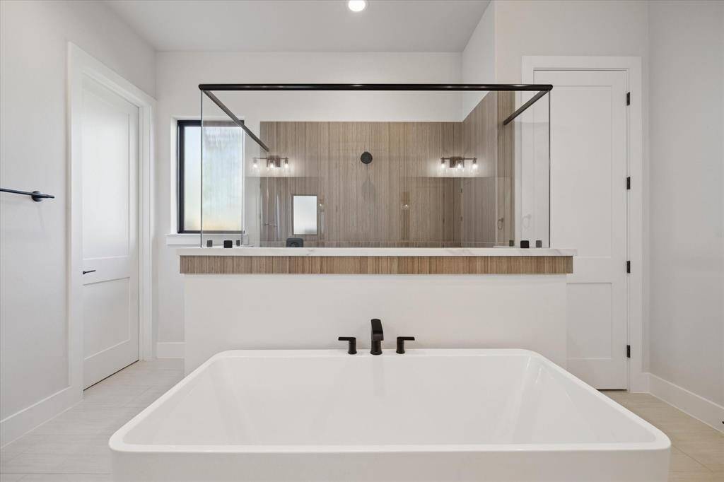 Primary Bath has soaking bathtub and walk-in shower