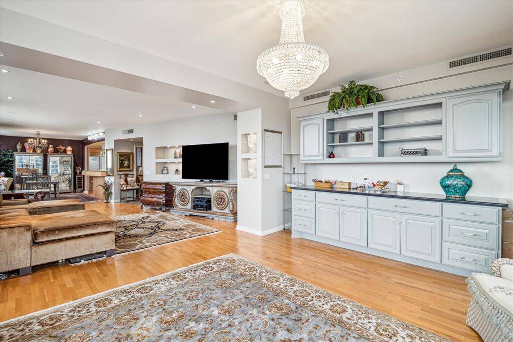 The view from the den toward the dining room shows the spacious room sizes.
