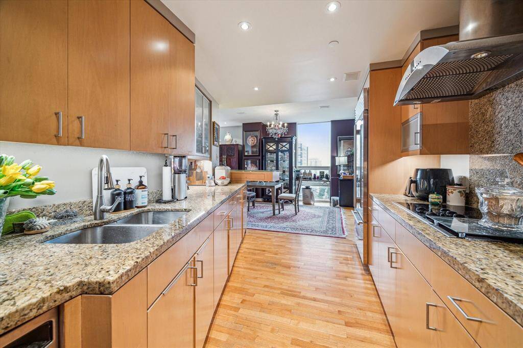 Looking from the utility area through the kitchen leads to the dining room.