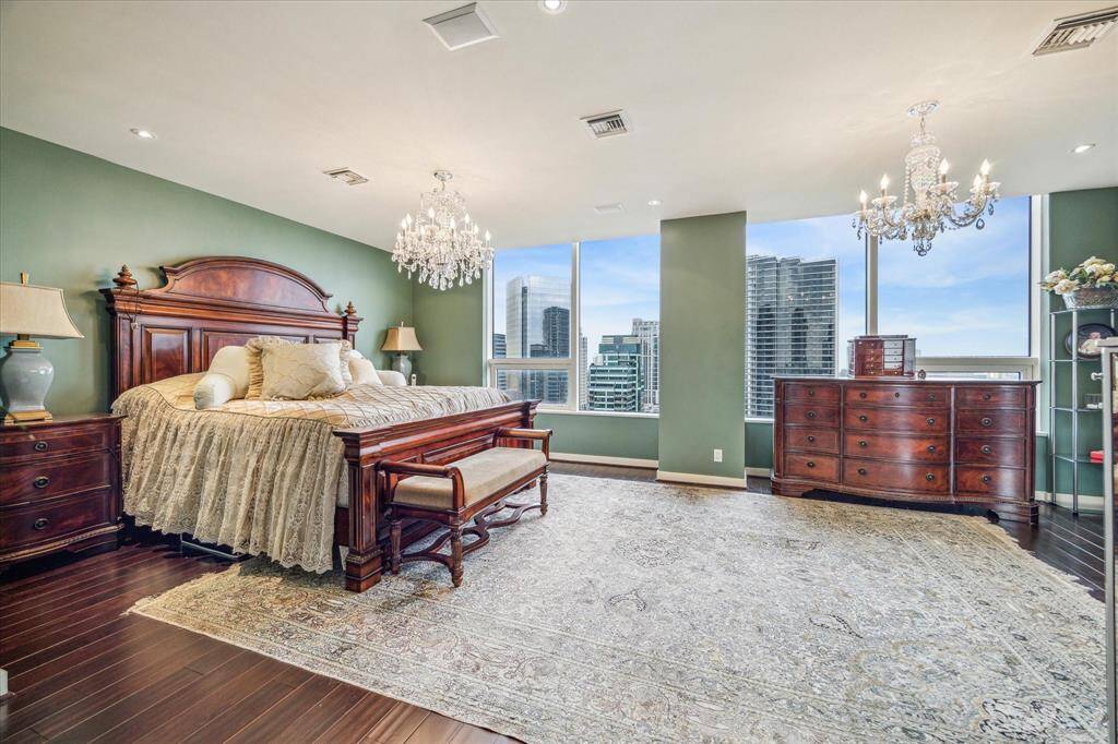 The spacious bedroom has beautiful views.