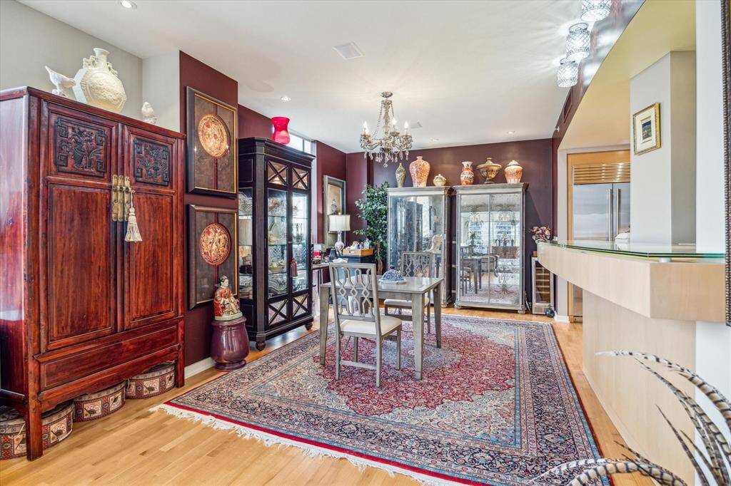 The dining room accommodates numerous VERY LARGE china cabinets and opens to the kitchen or bar area.