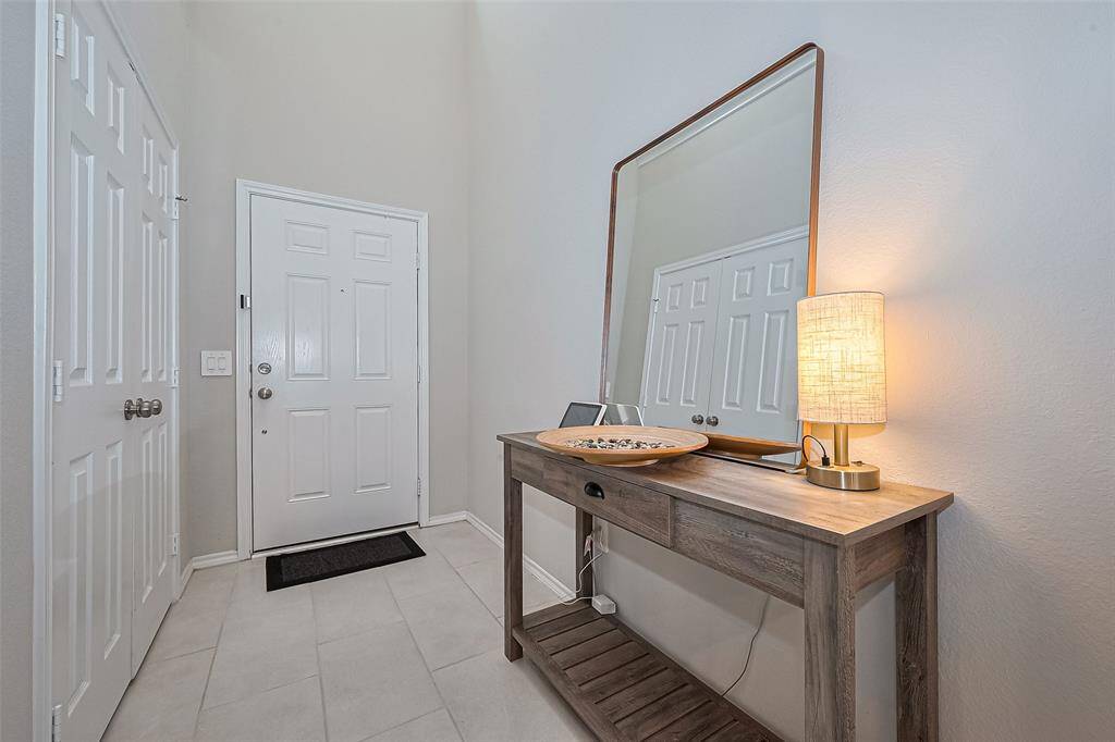 Hallway at the entrance with a coat closet on the side
