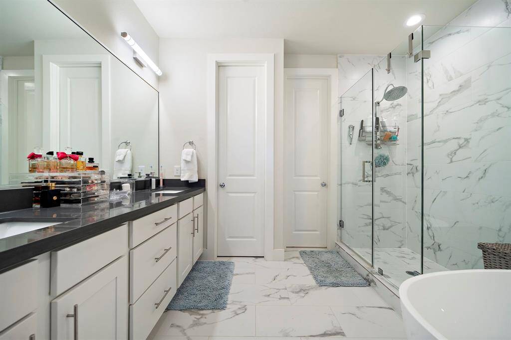 A true primary bath room with a soaking tube as, large walk-in shower, double sinks and a water closet.