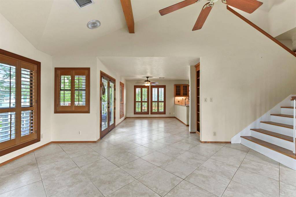 Upon entering, the kitchen seamlessly flows into the dining area, creating a welcoming open space.