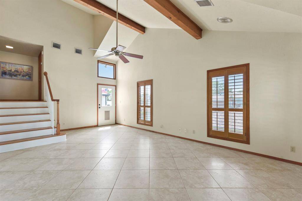 Conveniently located at the end of the den, a door provides easy access to the lift.