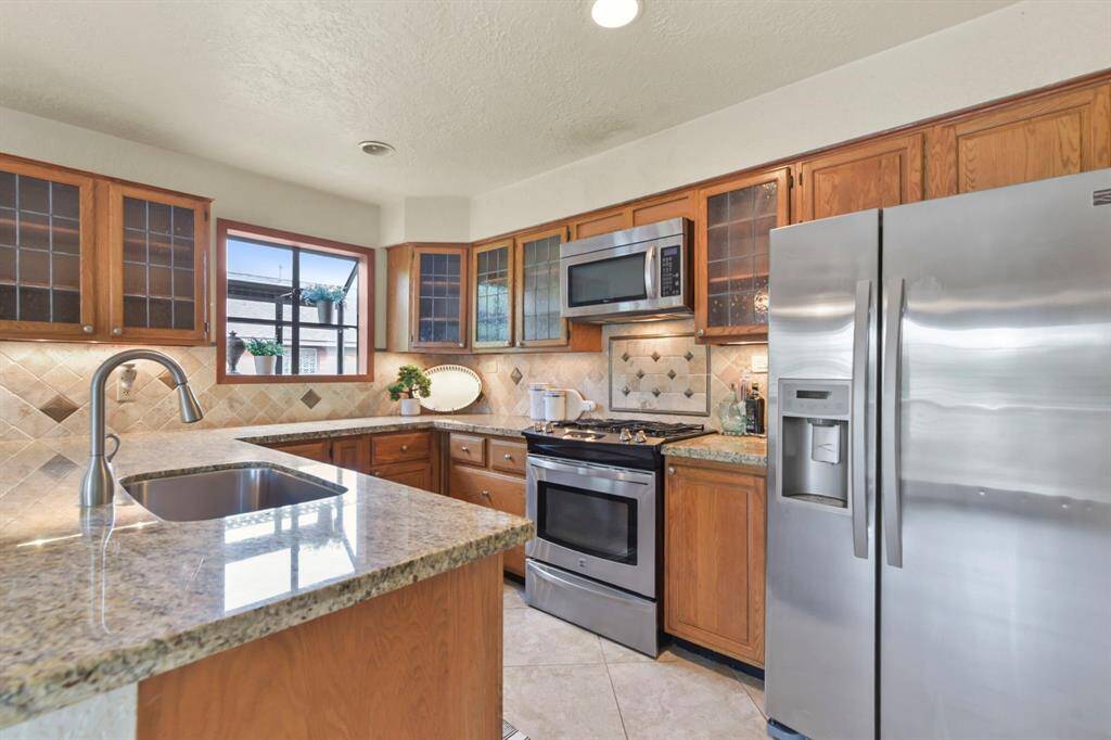 This kitchen features a charming bay window, perfect for cultivating your favorite herbs and plants.