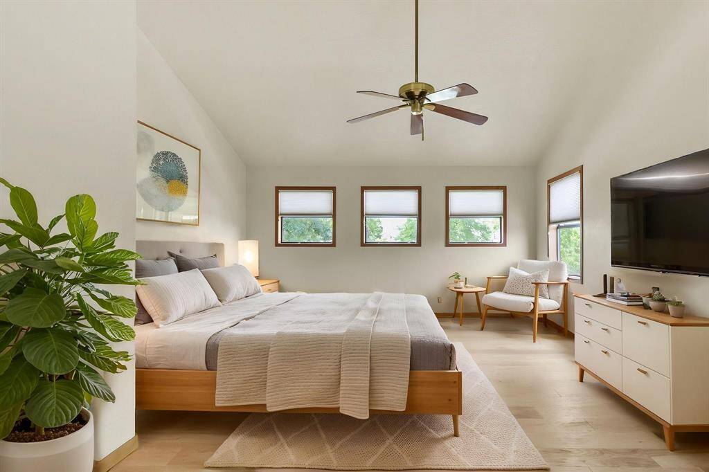 The primary bedroom is a serene retreat located on the third level.
