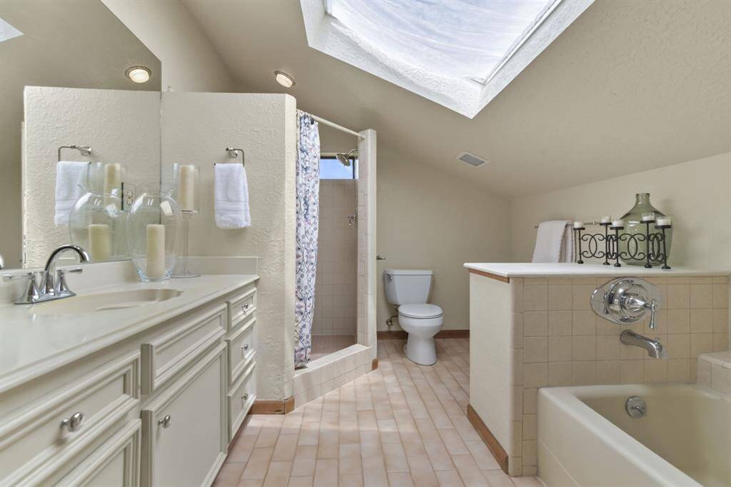 Indulge in the Primary Suite's luxury with a soaking tub and a separate walk-in shower.