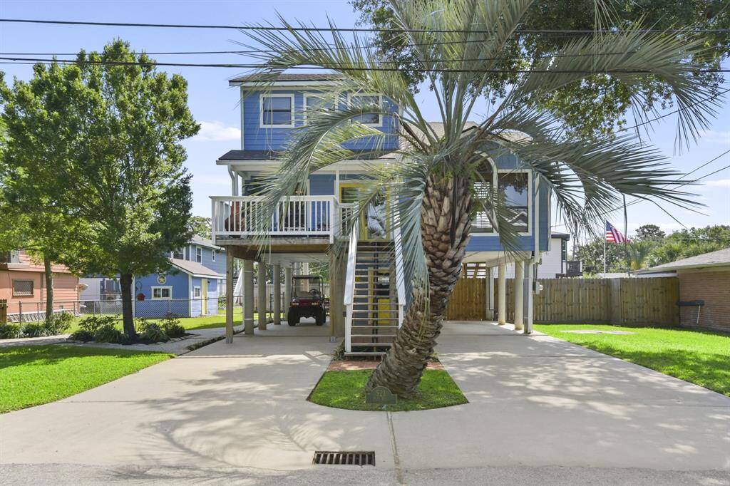 Expansive double driveway with versatile space below the home offers endless possibilities.