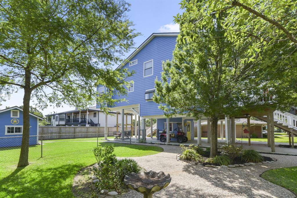Discover this spacious 8,000+ sq. ft. lot featuring a large fenced backyard, a charming front yard with a birdbath, and mature trees.
