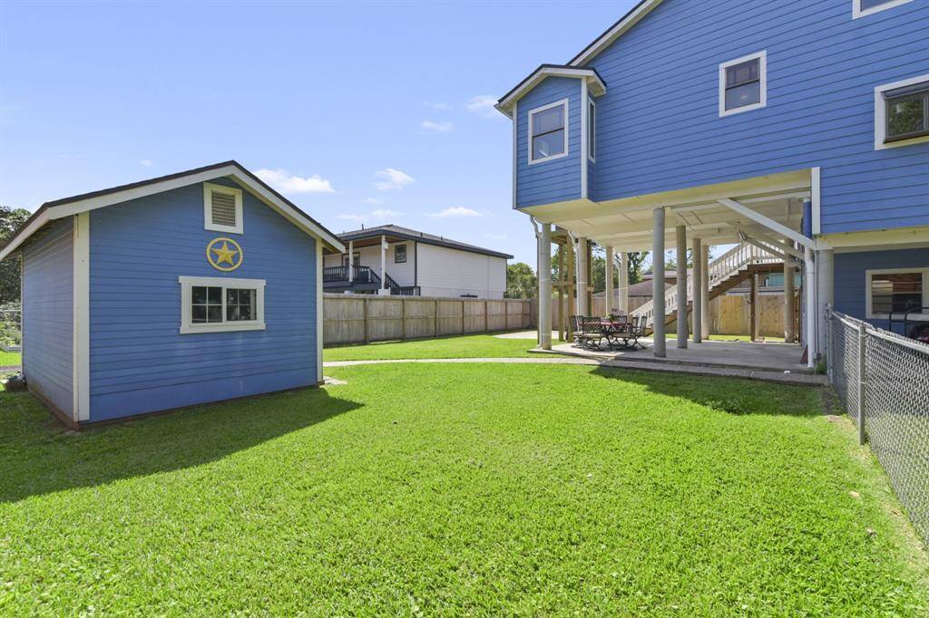 Charming backyard "She-Shed" perfect for a craft space, gym, or extra storage.