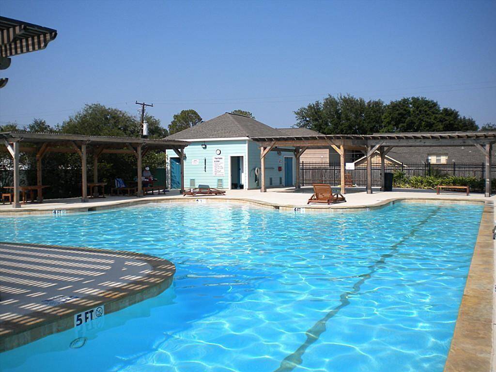 Enjoy the neighborhood pool, complete with ample shade and a dedicated baby pool for family fun.