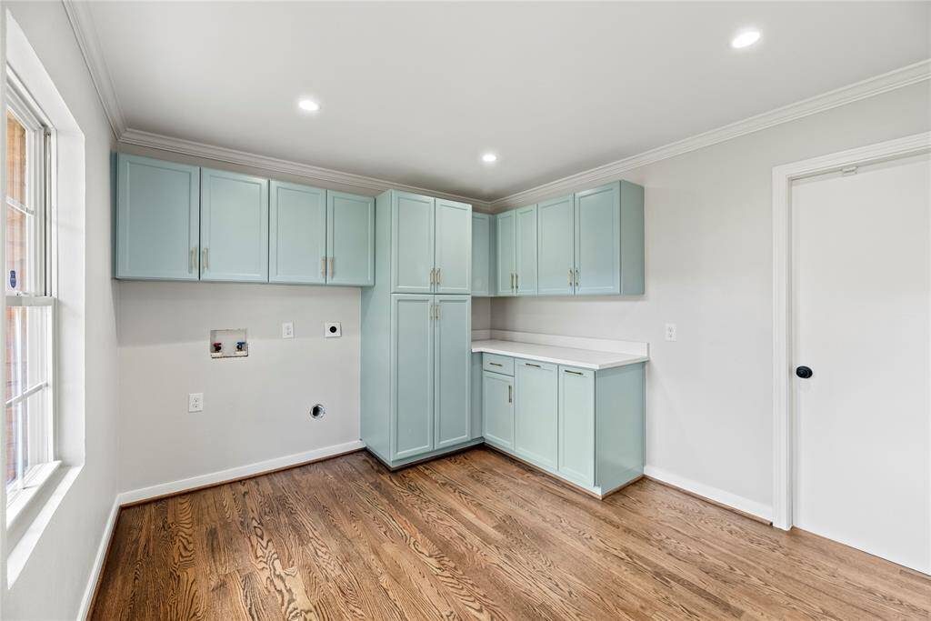 Enter the laundry room from the kitchen, garage or from the back yard. Great storage!