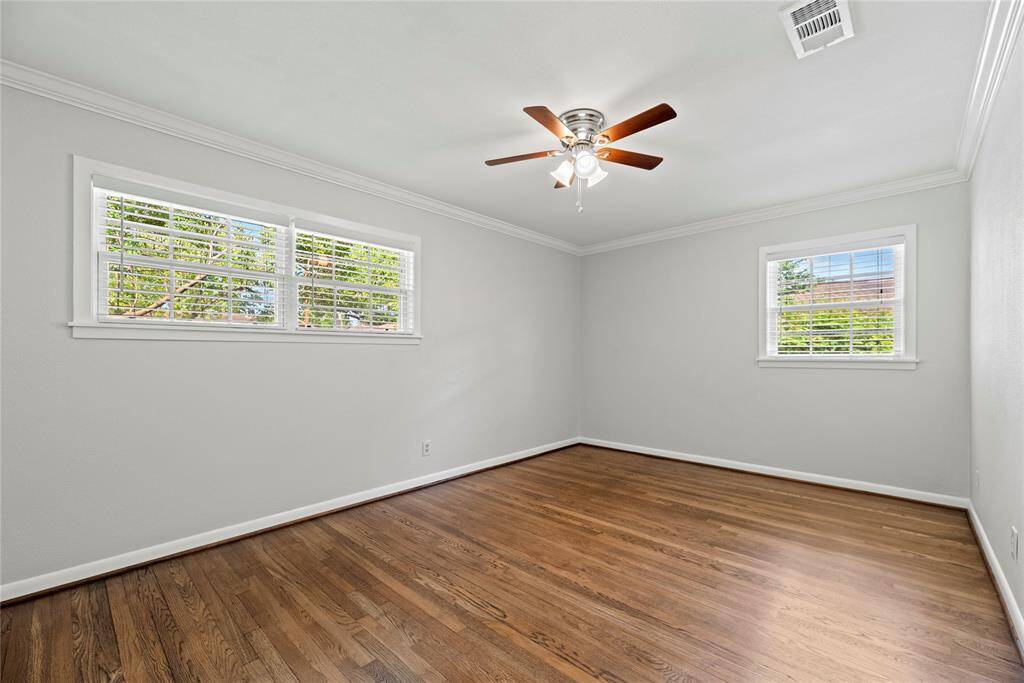 Big secondary bedrooms with closets, windows, and ceiling fan.