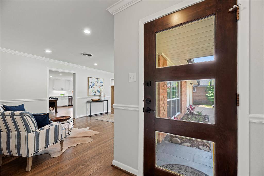 Upon entry you'll notice the gorgeous oak original hardwoods that run throughout the home.