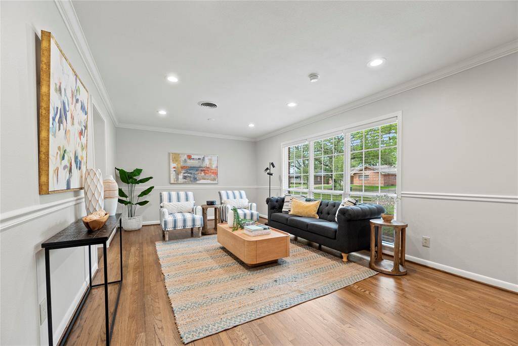 Big windows look out onto the front yard and fill this living room with natural light.