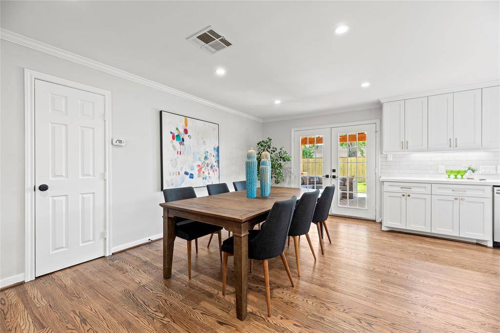 There's room for everyone in this dining room. The French doors lead to the wonderful back patio and yard.