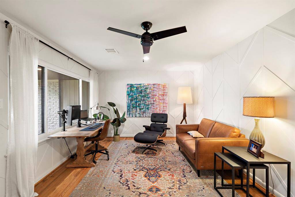 Custom trim work in the den provides extra character. Currently used as an office, it could just as easily serve as formal sitting or dining room.