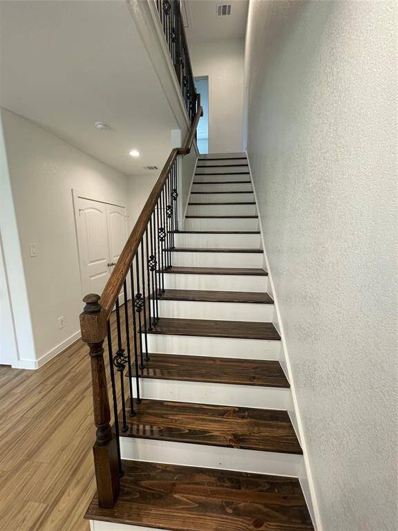Staircase with beautiful wroth iron railing