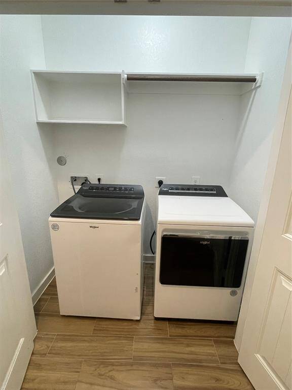 In-home utility room with full sized washer and dryer