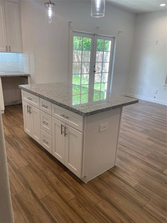 Lovely kitchen island with storage and electrical outlet