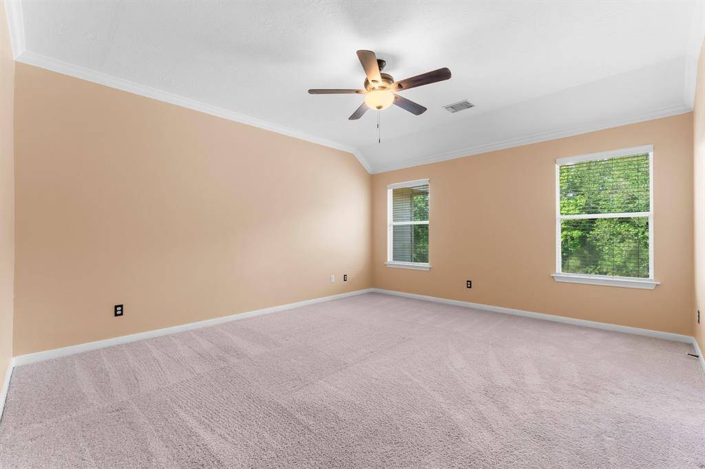 Primary bedroom at the back of the home.