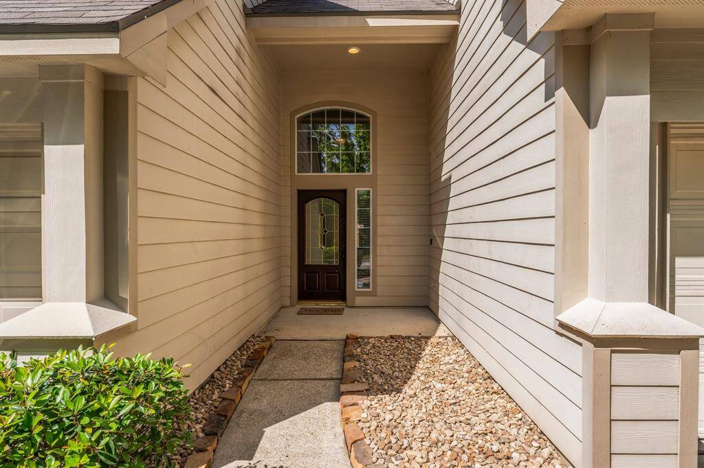 New landscaping that is easy to take care of adds great curb appeal to this lovely townhome.