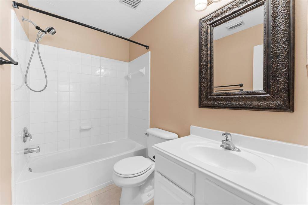 Secondary bathroom with easy access to the secondary bedrooms and game room.