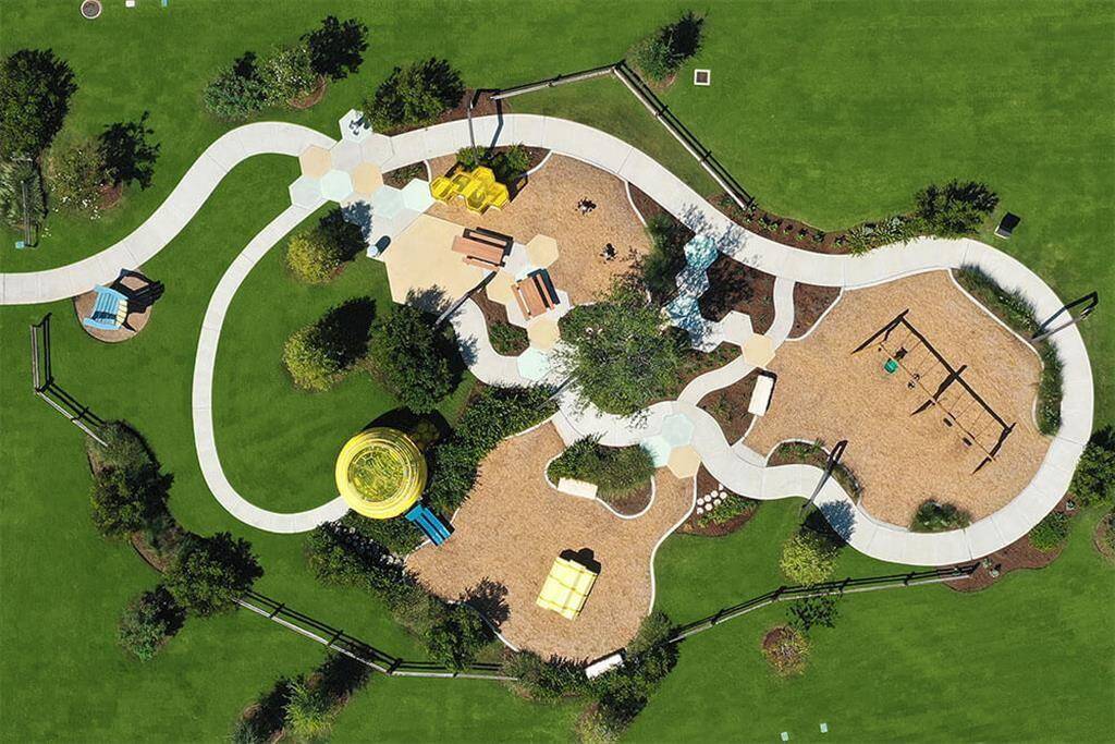 This honeycomb themed playground has slides, swings, and climbing structures for your little ones to safely explore.