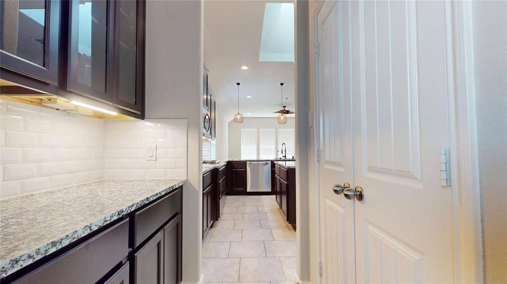 The double doors on the right lead to the pantry