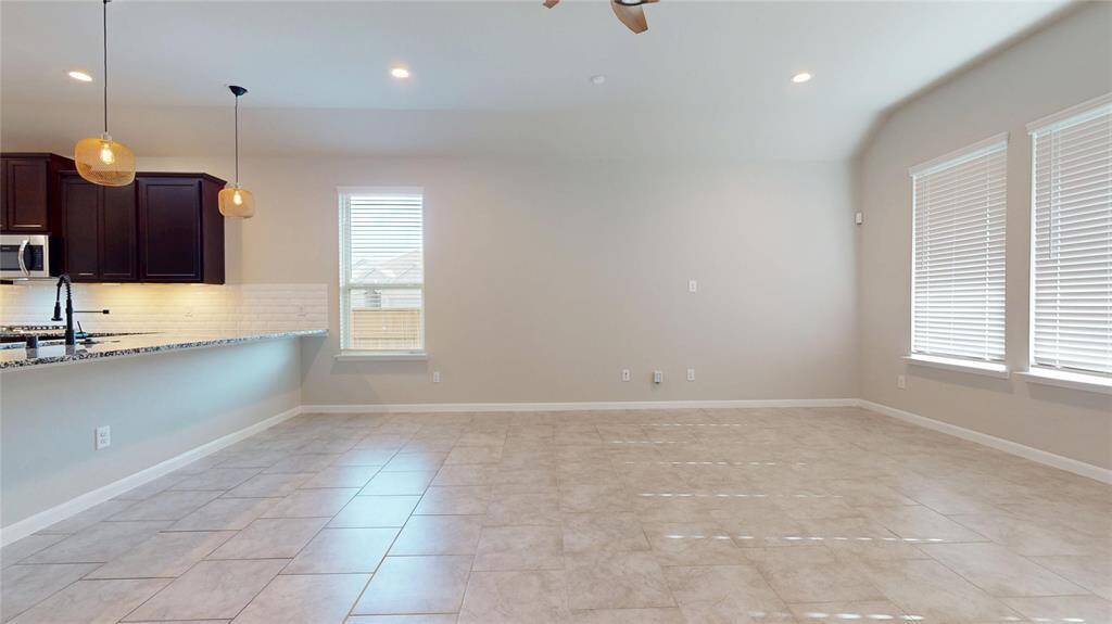 The family room has lots of natural light from the rear and side windows.