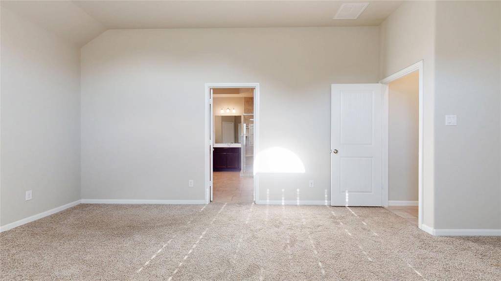 Another view of the primary bedroom.