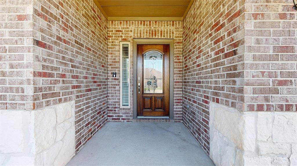 Front Entry. This home is bricked on three sides and has stone accents on the front facade - lending to lower maintenance.