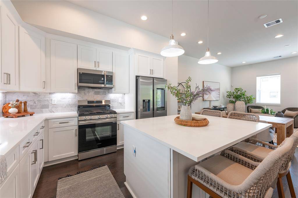 Modern kitchen with sleek cabinetry, stainless steel appliances, and a spacious island perfect for entertaining.