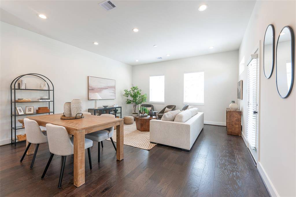 Elegant open-concept dining and living area with modern finishes and abundant natural light.