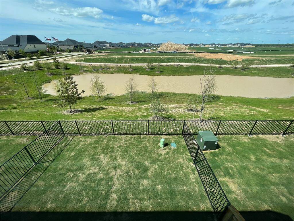 The lake view backyard is fully fenced.