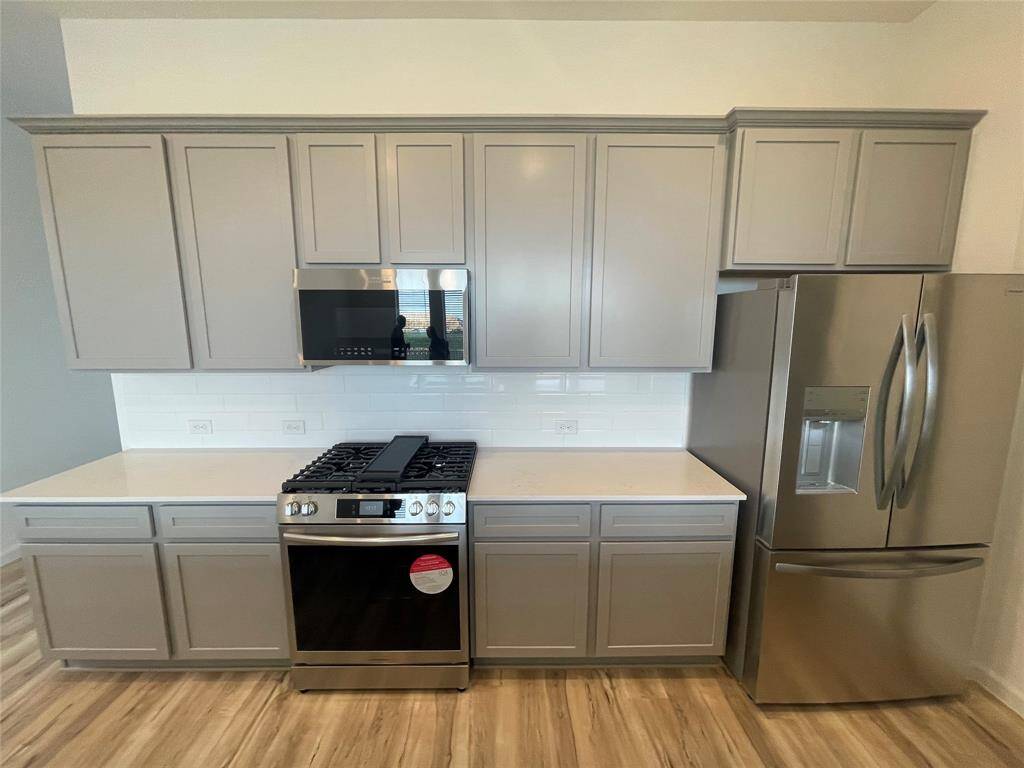 The refrigerator is included and the microwave has an air fryer mode!