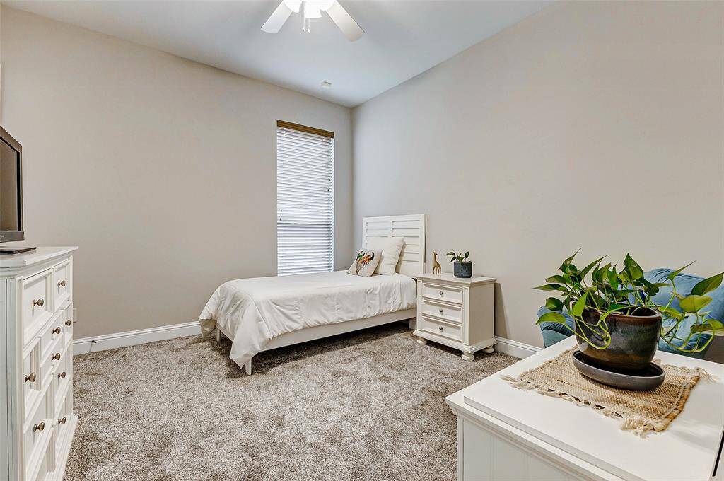 This bedroom is designed to provide a practical and inviting space where residents can relax and unwind, showcasing a blend of durability, comfort, and aesthetic appeal.