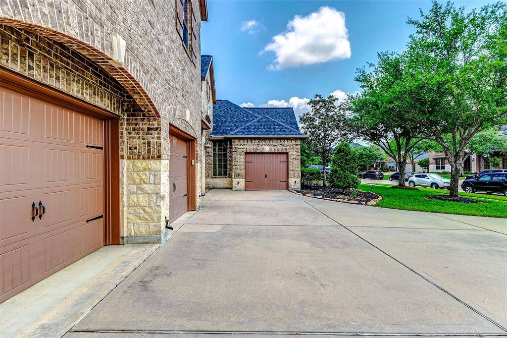 A separate garage bay with a private entrance is conveniently located near the second downstairs bedroom — an ideal setup for an au pair, in-law suite, or private guest quarters, offering added privacy and independence.