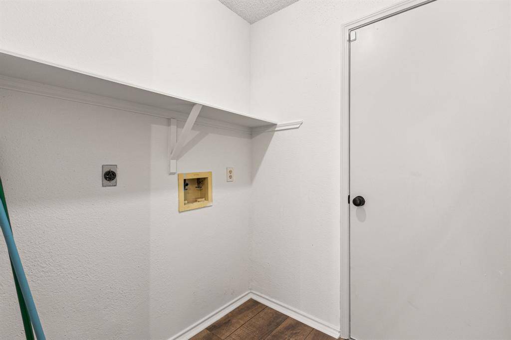 Laundry room is thru access from the garage and has extra storage