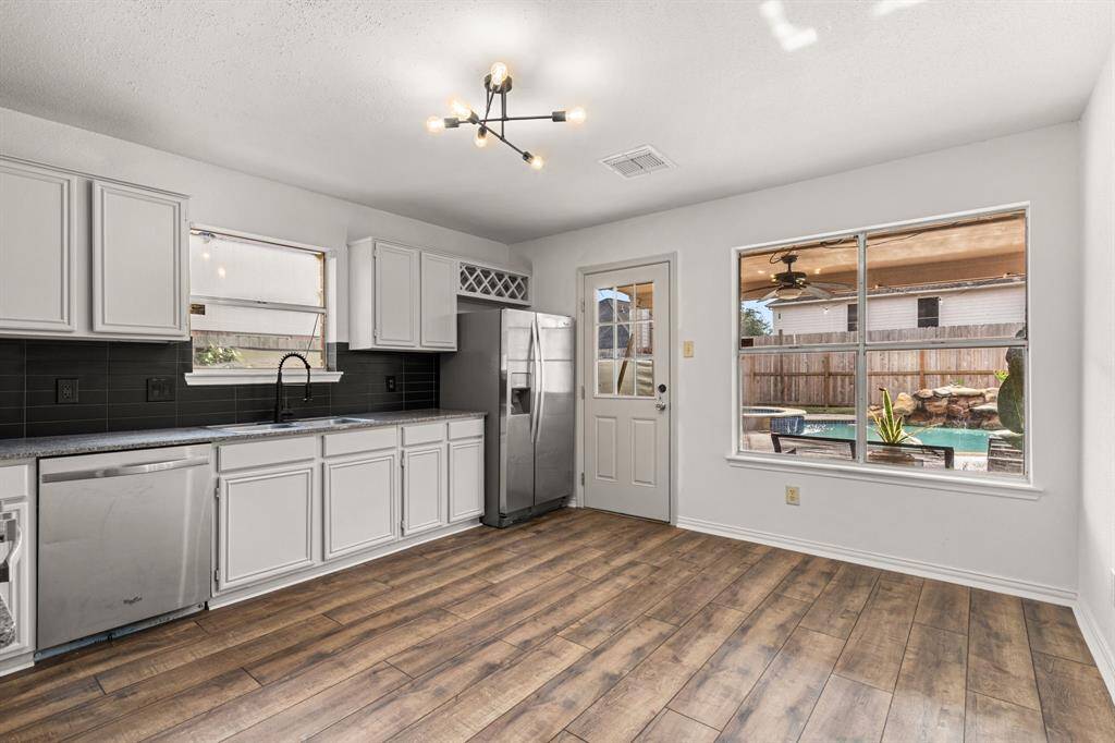 Kitchen has room for extra seating if you choose!