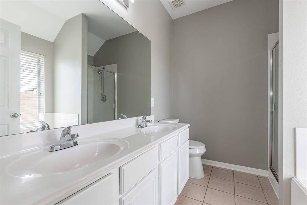 Double sinks in the primary bathroom.