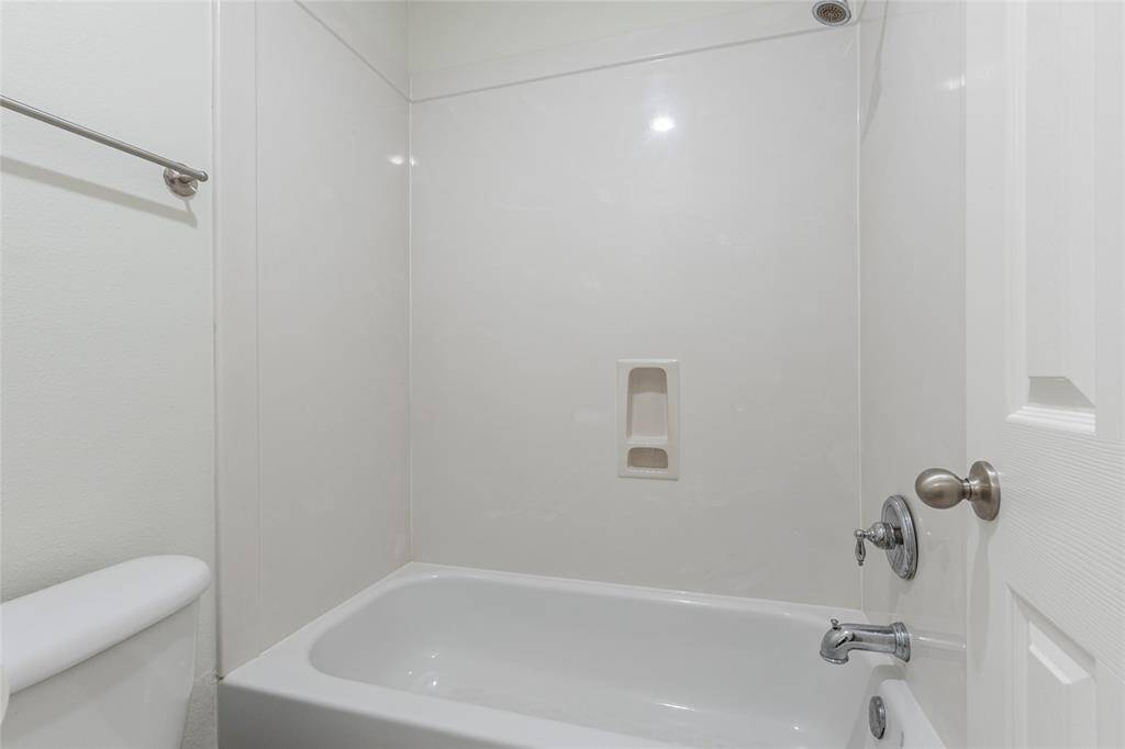 Tub/shower combo in secondary bathroom.